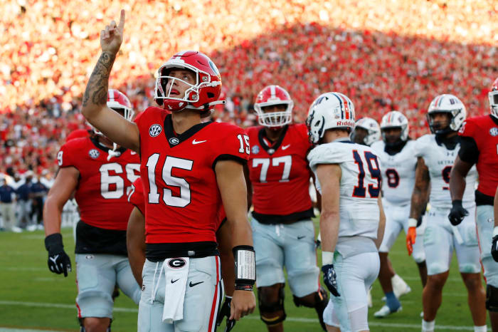 Georgia starting QB Carson Beck celebrates after running for a touchdown in the second quarter of Georgia's season-opening win over UT-Martin.